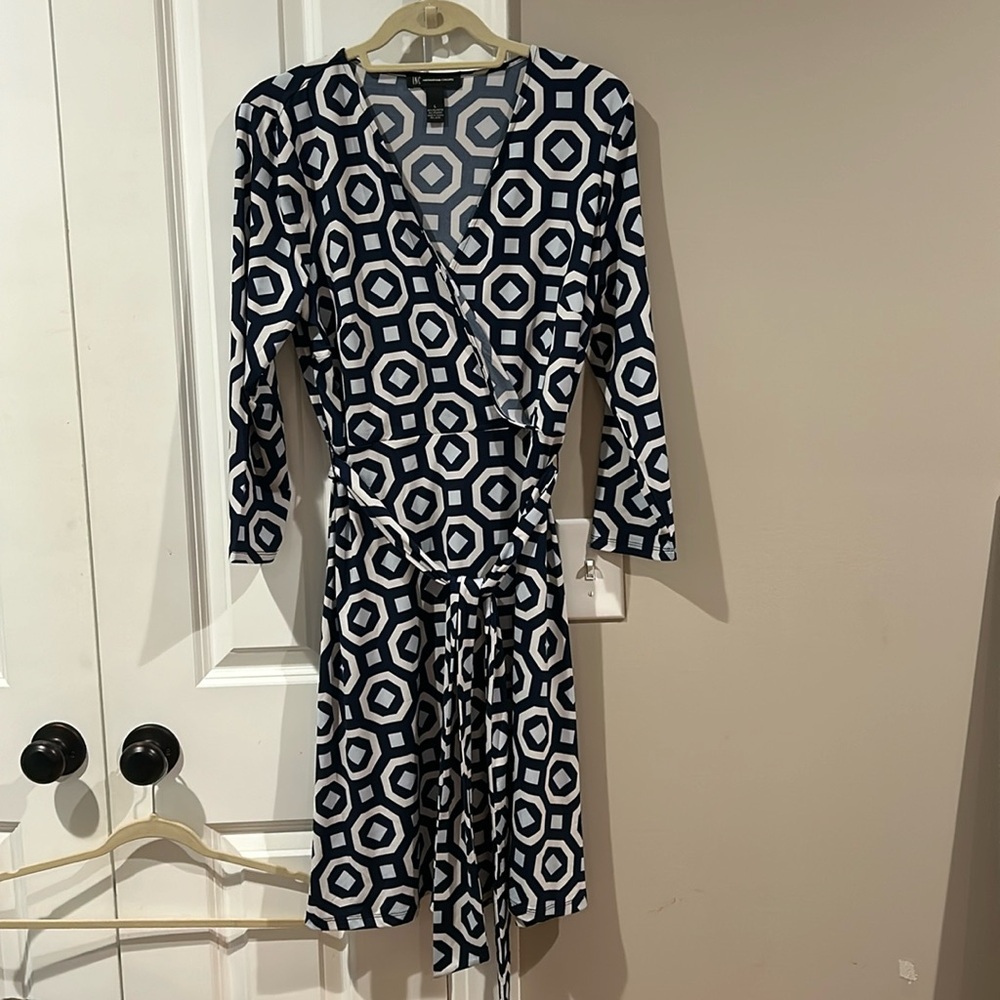 Navy blue, geometric pattern wrap style dress.
